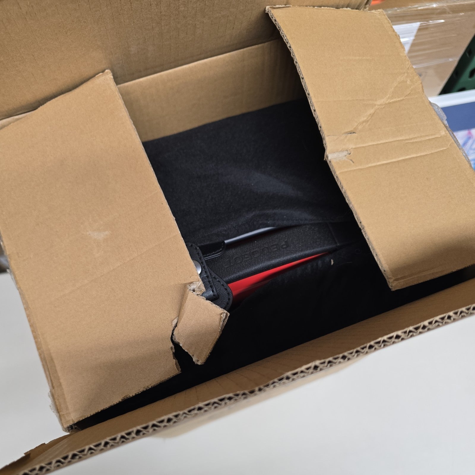 Orange PEUGEOT FRANCE  RED PEUGEUT Zip International Carry-On Spinner 