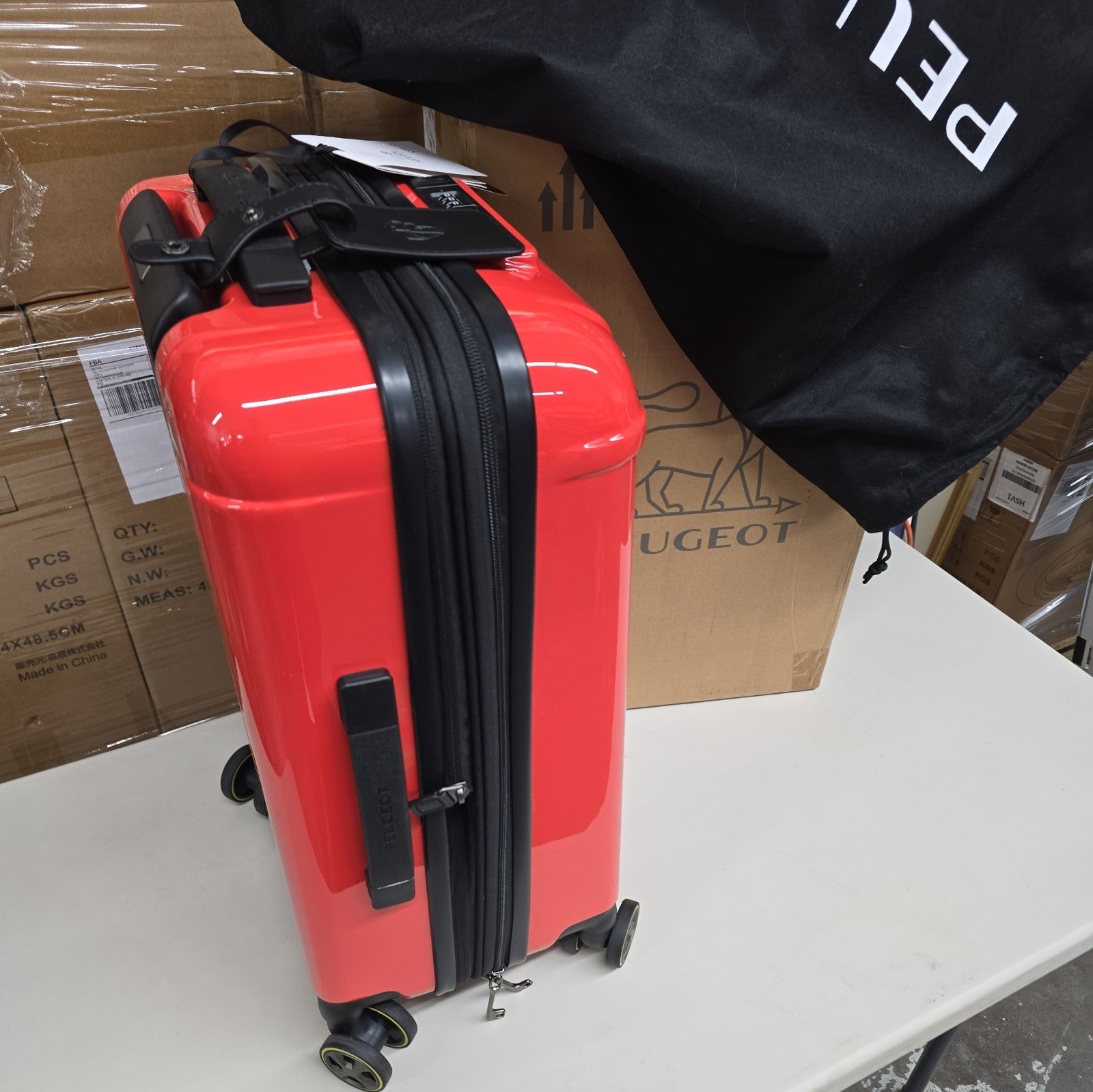 Orange PEUGEOT FRANCE  RED PEUGEUT Zip International Carry-On Spinner 