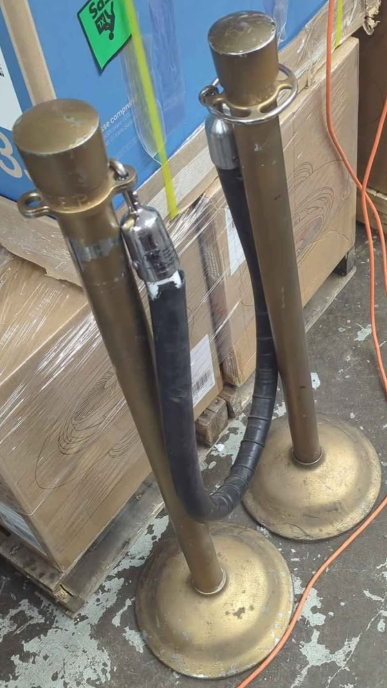 Vintage Set of two Stanchions with a black rope